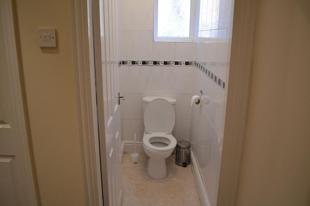 Bright and tidy bathroom with a modern toilet, ...