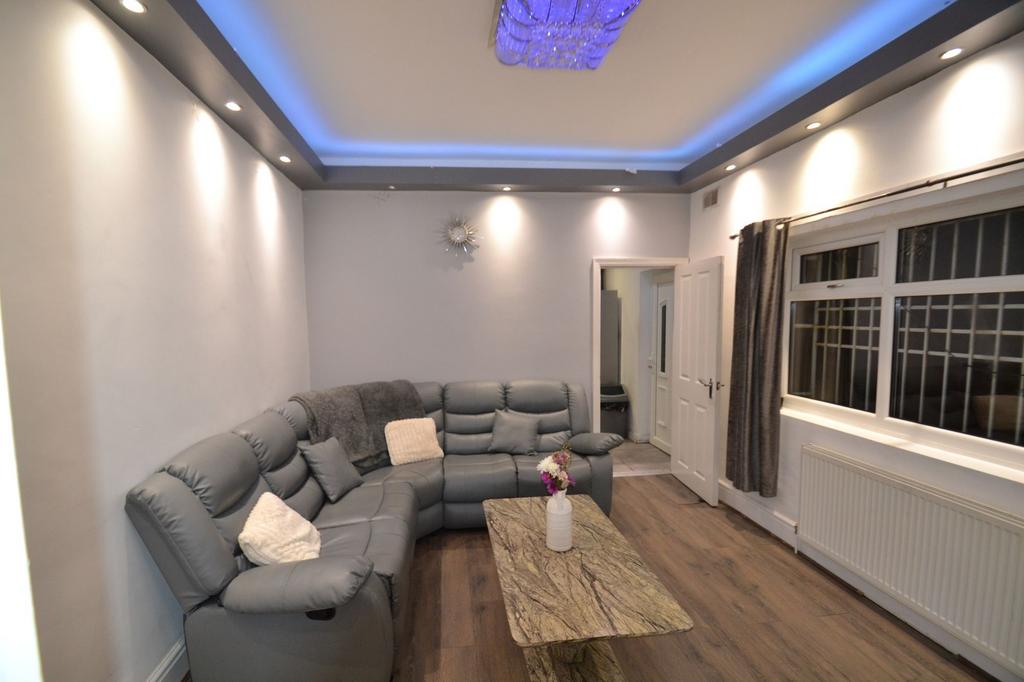 Bright, modern living room with a grey L-shaped...