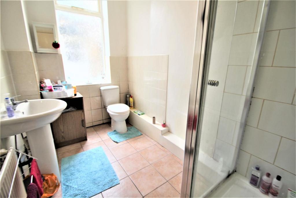 A clean and functional bathroom with a toilet, ...