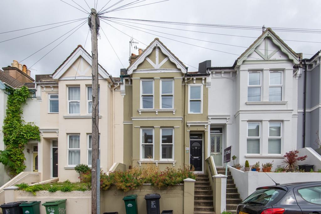 A charming front exterior view of a terraced ho...