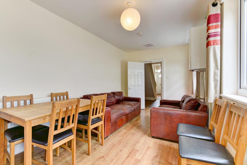 Bright, well-kept living room with wooden floor...