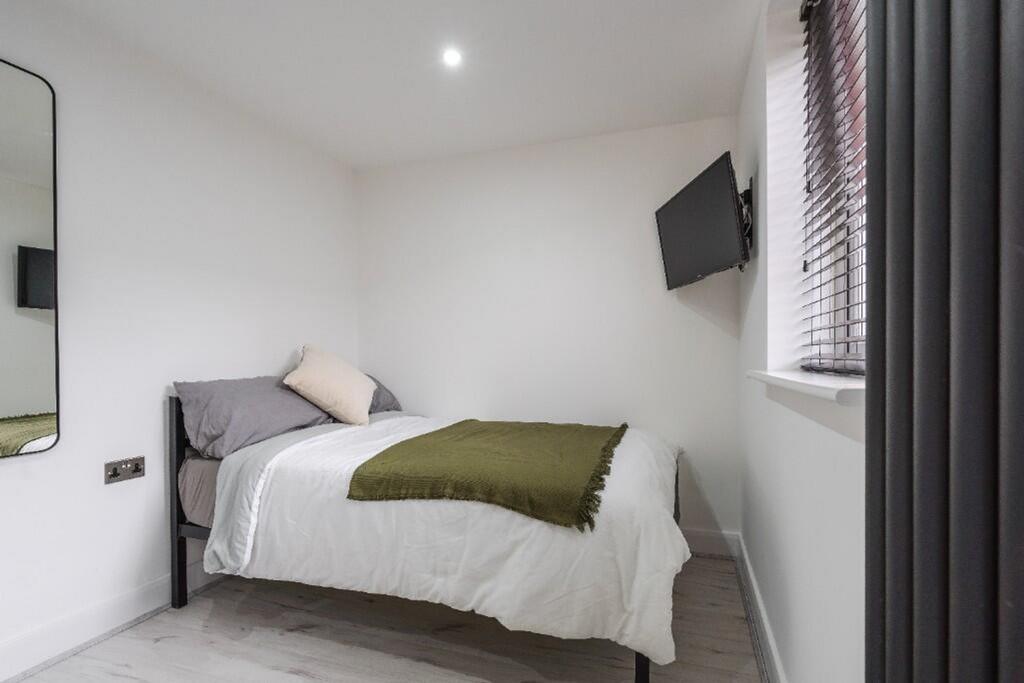 Cozy double bedroom featuring a comfortable bed...