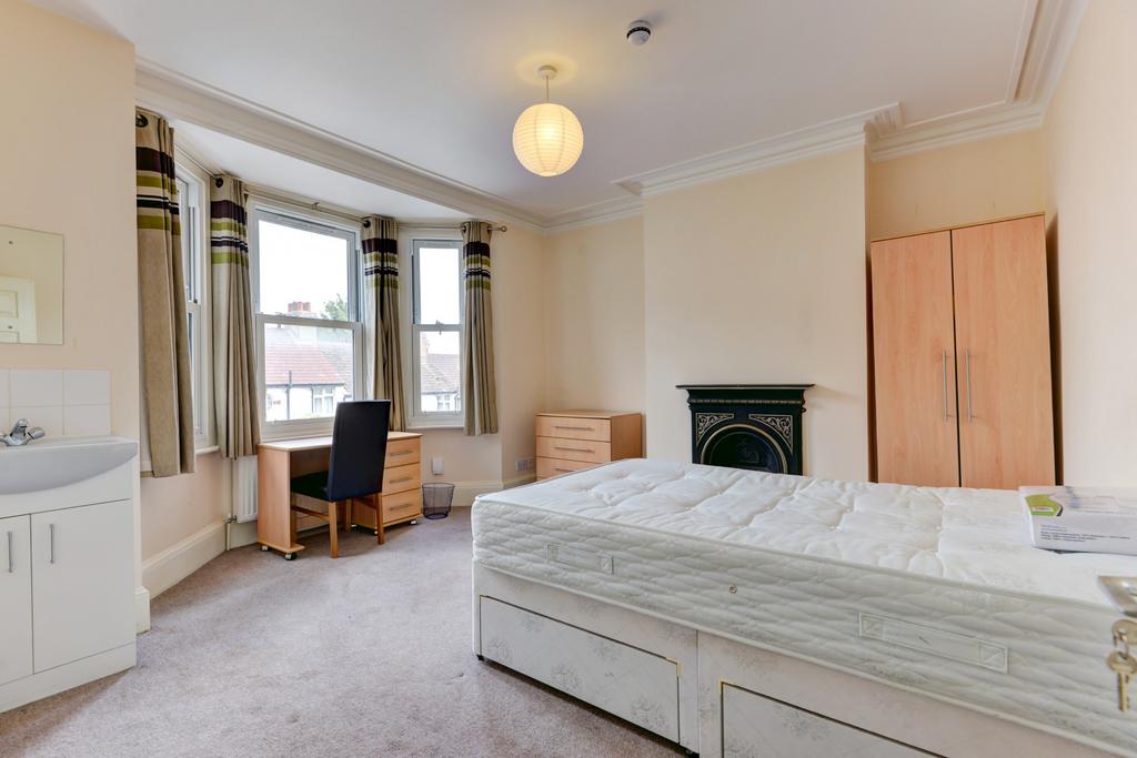 A bright and spacious master bedroom featuring ...