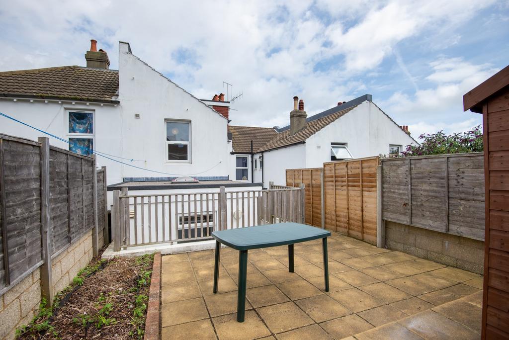 Low-maintenance paved rear garden with fenced p...