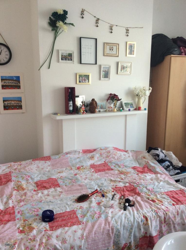 A spacious and welcoming bedroom featuring a la...
