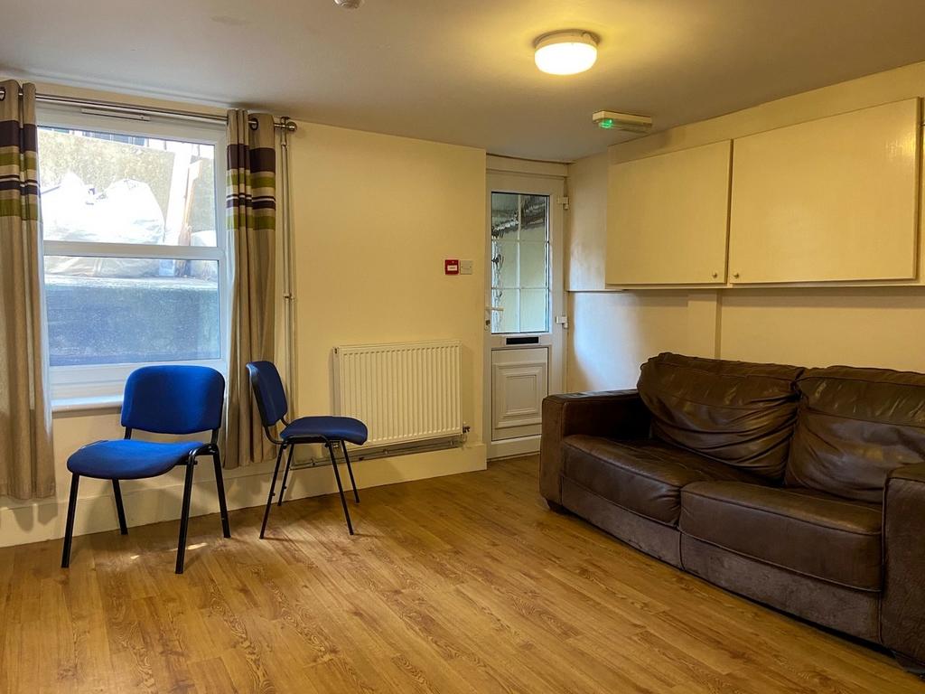 A welcoming living room featuring a comfortable...