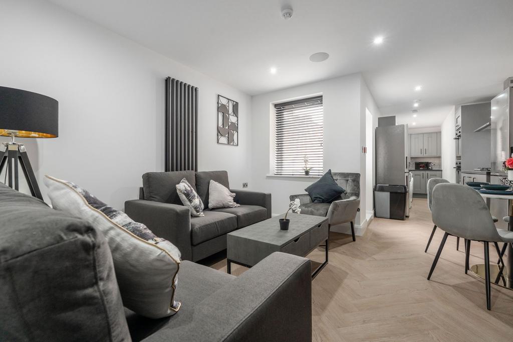 Modern and stylish living room featuring comfor...
