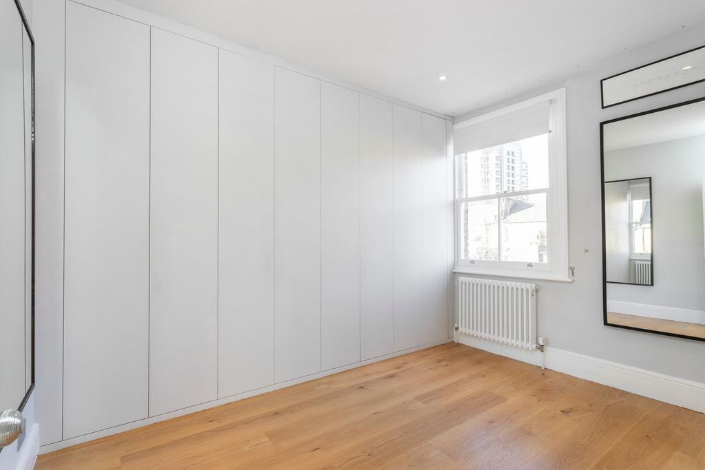 Fouth bedroom with extensive built in storage