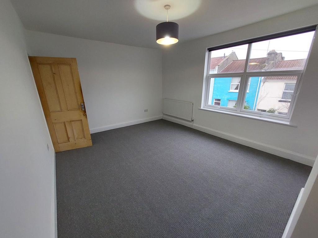 Bright, freshly painted double bedroom with a l...