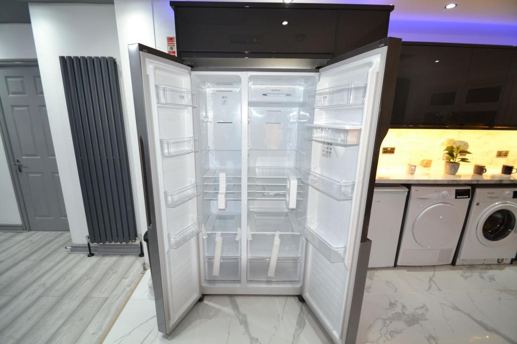 Modern kitchen with a large open stainless-stee...