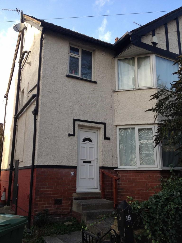 A charming front view of a semi-detached house ...