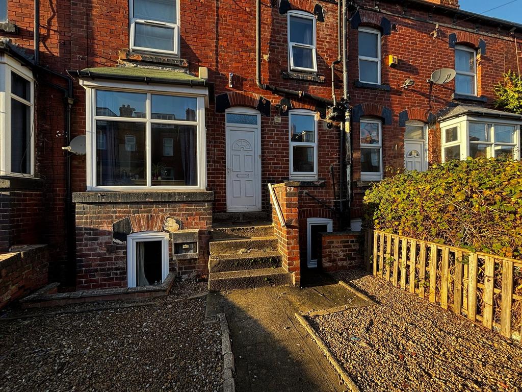 Attractive red-brick terraced house frontage wi...