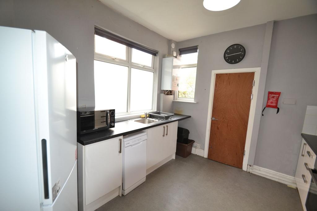 Bright and functional kitchen area featuring a ...
