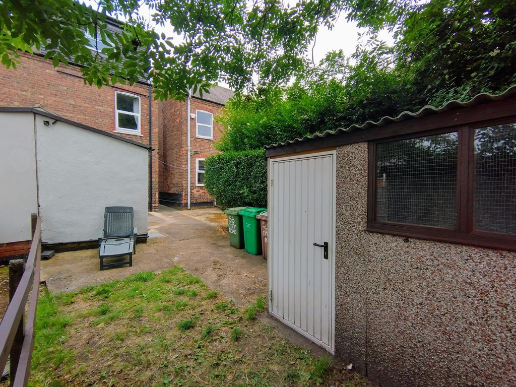 Private rear garden with a paved area, lawn pat...