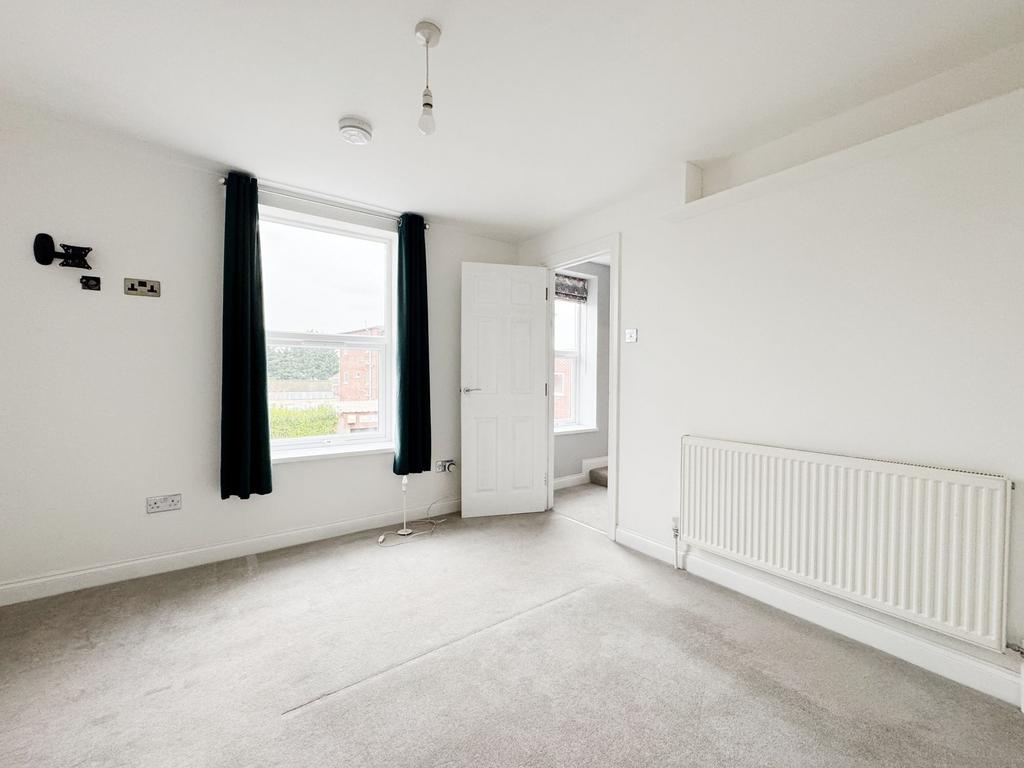 Bright, freshly redecorated bedroom with large ...