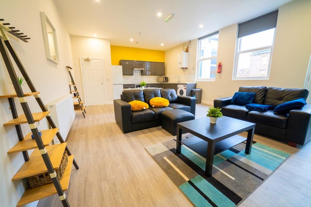 A spacious and well-lit contemporary living roo...