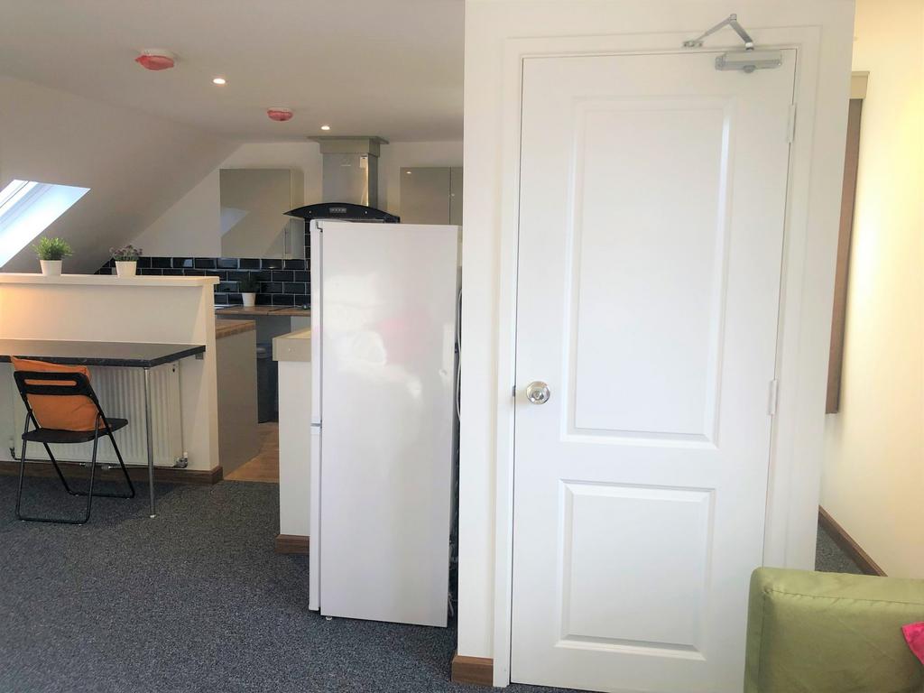 Bright and modern kitchen area featuring a clea...
