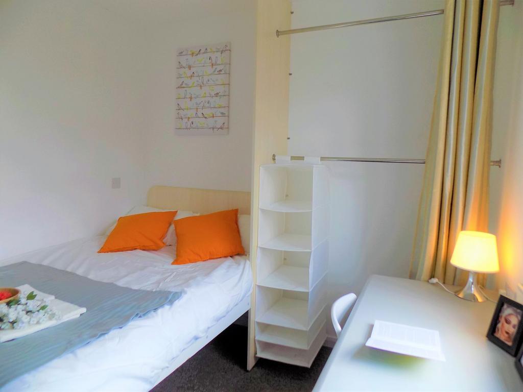 A cozy double bedroom featuring a neatly made b...