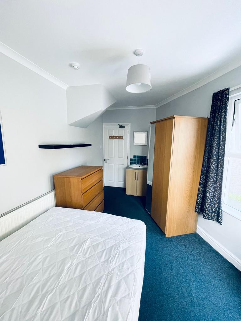 Bright, neatly presented bedroom with a double ...