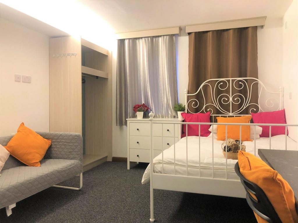 Bright and cozy double bedroom featuring a styl...