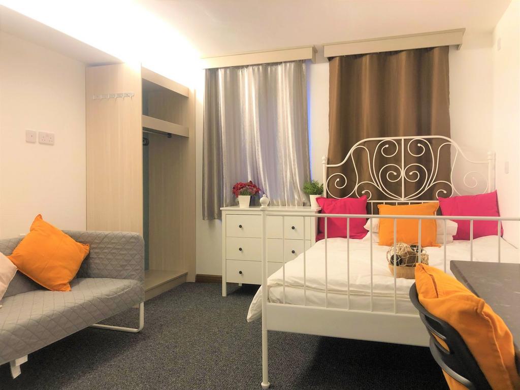 Bright and cozy double bedroom featuring a styl...