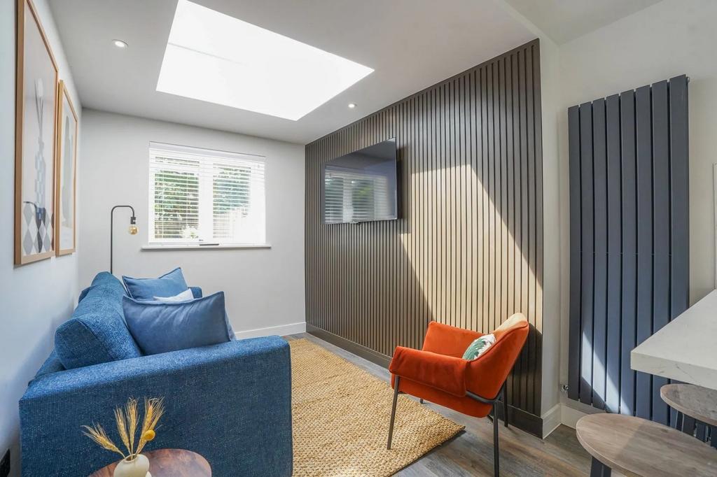 Bright and inviting living room featuring a lar...