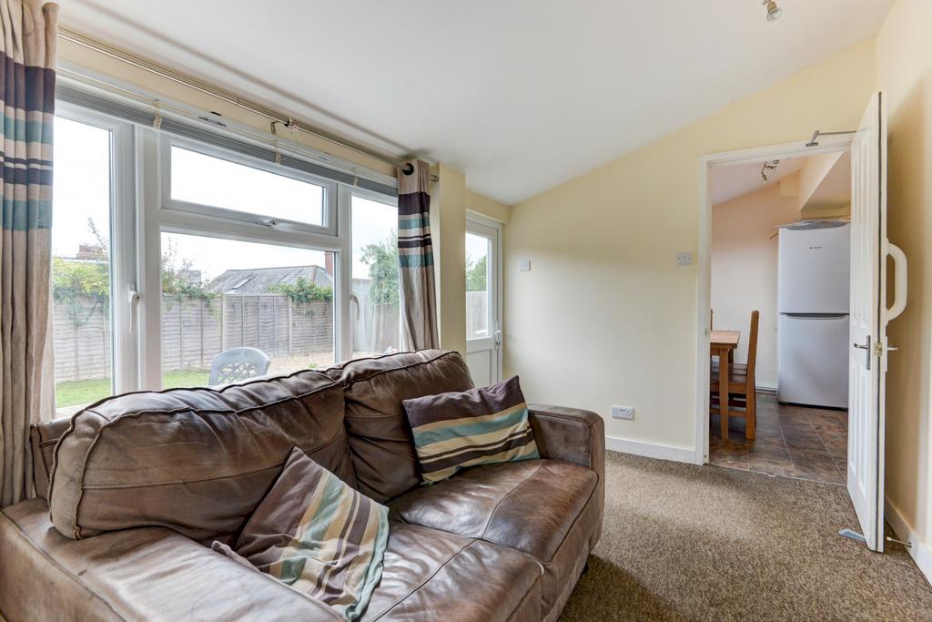 A welcoming living room featuring a large, comf...