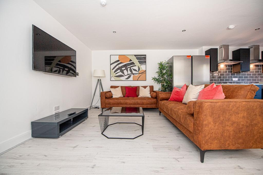 Modern and inviting living room featuring warm-...
