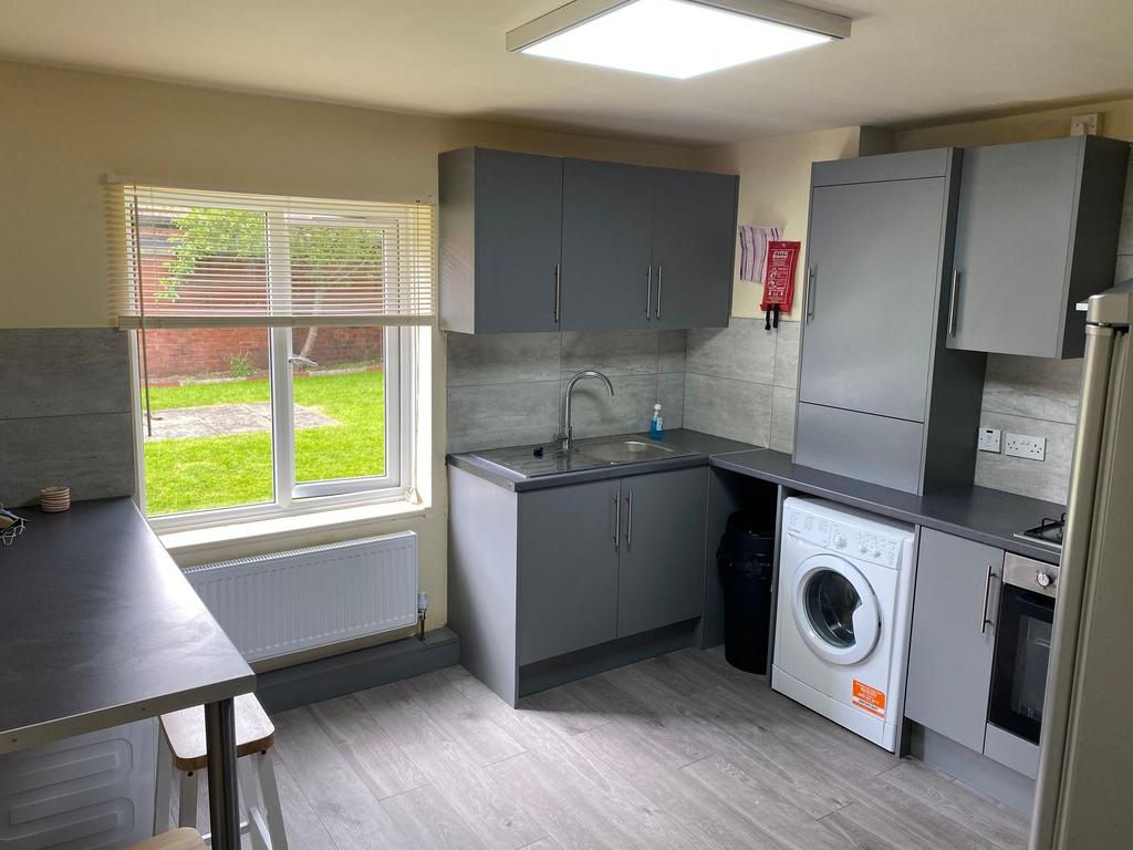 Modern and functional kitchen with ample natura...