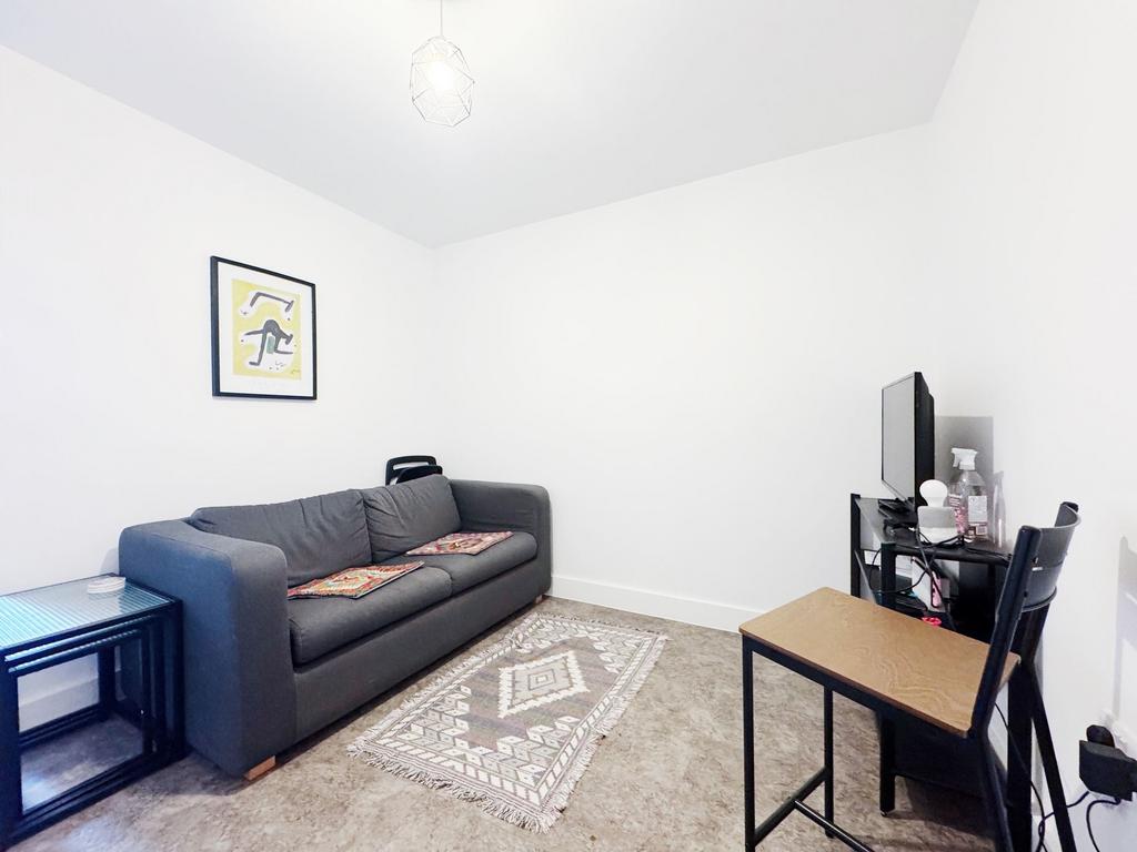 Bright, minimal living room with a comfortable ...