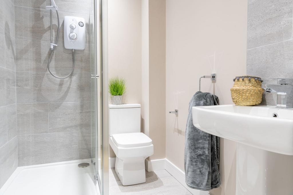Bright, modern bathroom with a walk-in shower, ...