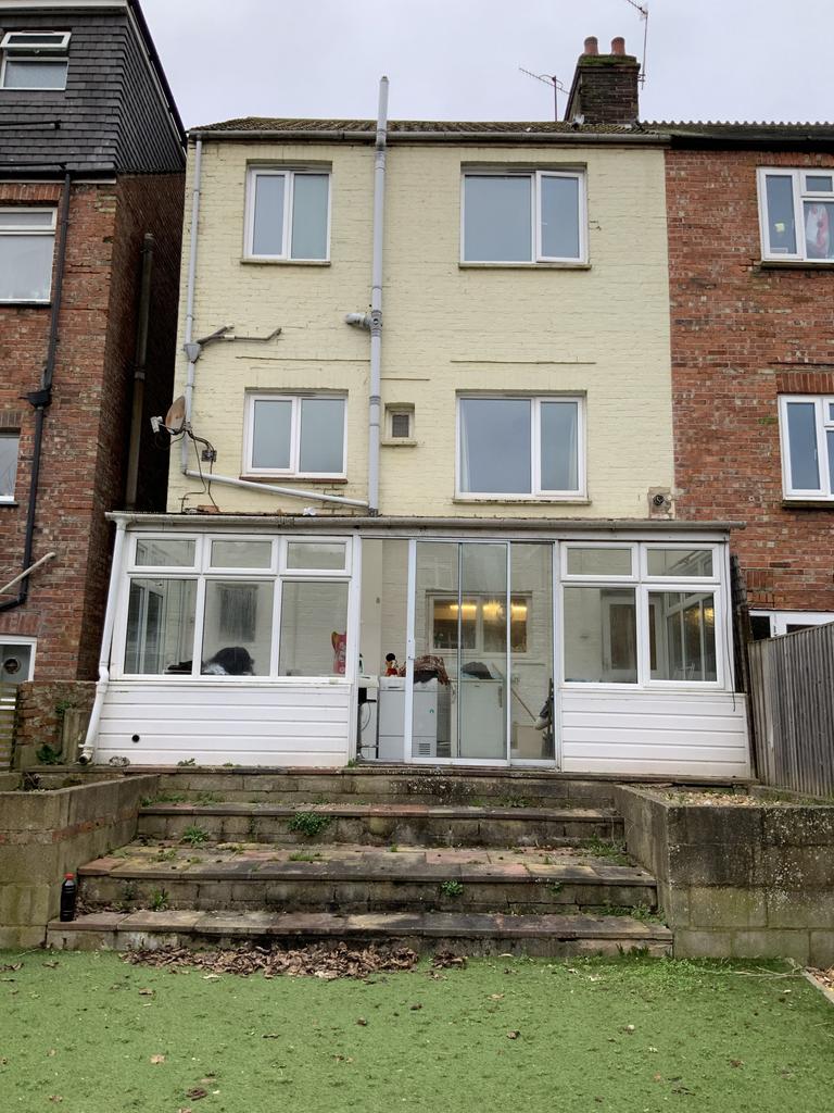 Well-maintained rear exterior of a terraced hou...