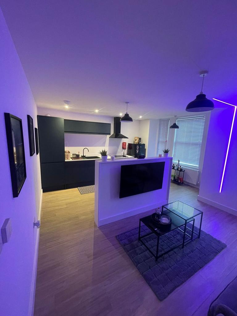 Contemporary open-plan living area with a sleek...