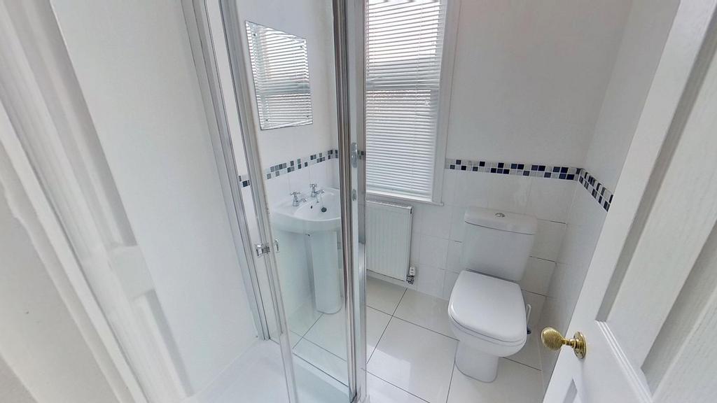 Bright and clean bathroom with a modern shower ...