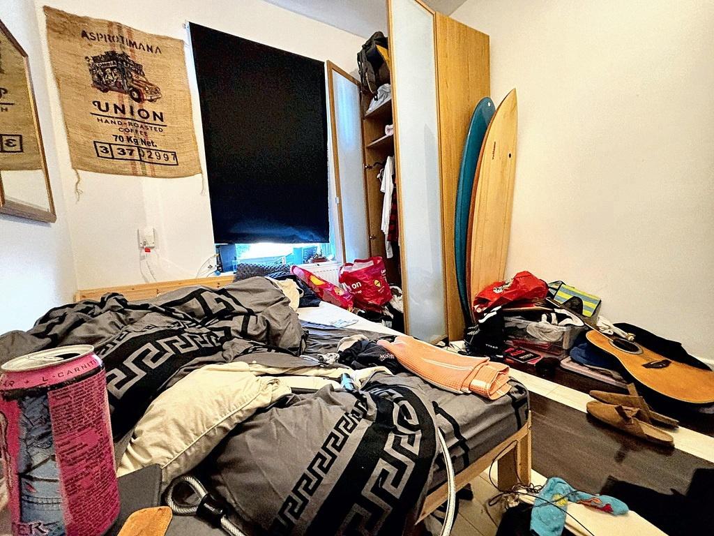 Cozy single bedroom with a comfortable bed, fit...