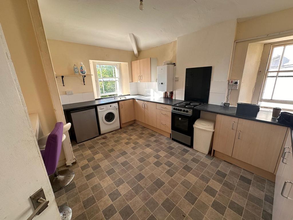 Bright, functional kitchen with plenty of count...