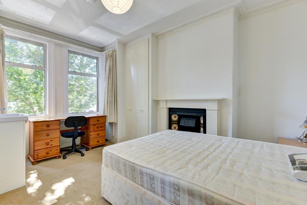 Bright, airy bedroom with large sash windows, n...