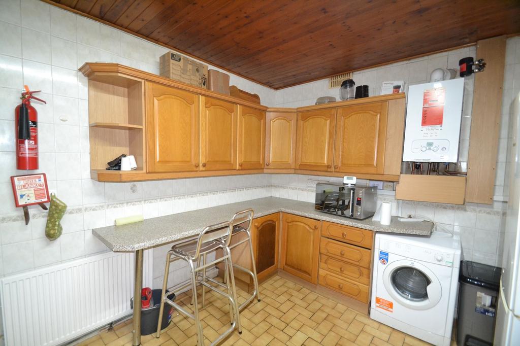 A warm, inviting kitchen featuring natural wood...