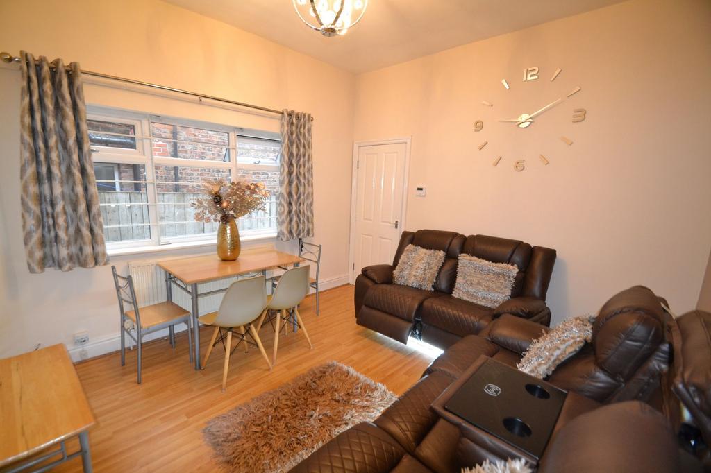 A cozy and well-maintained living room with com...