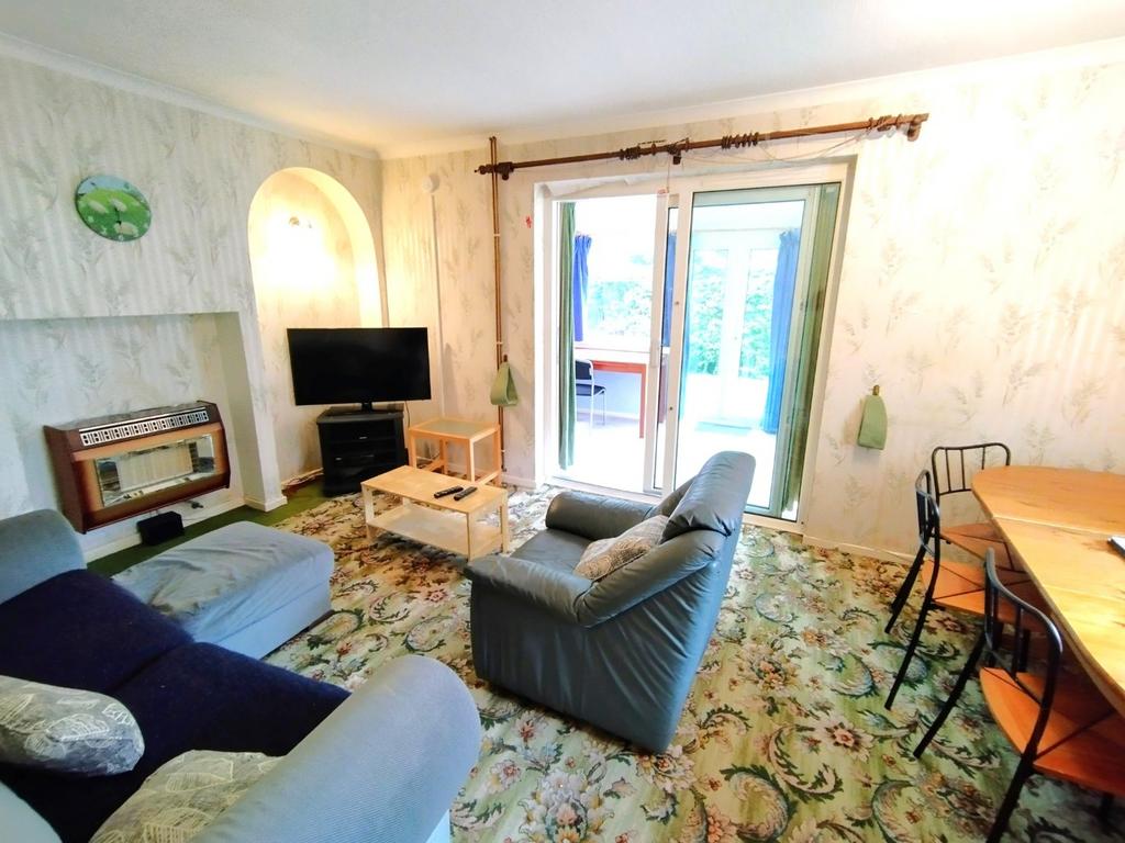Bright, comfortable living room with seating, a...