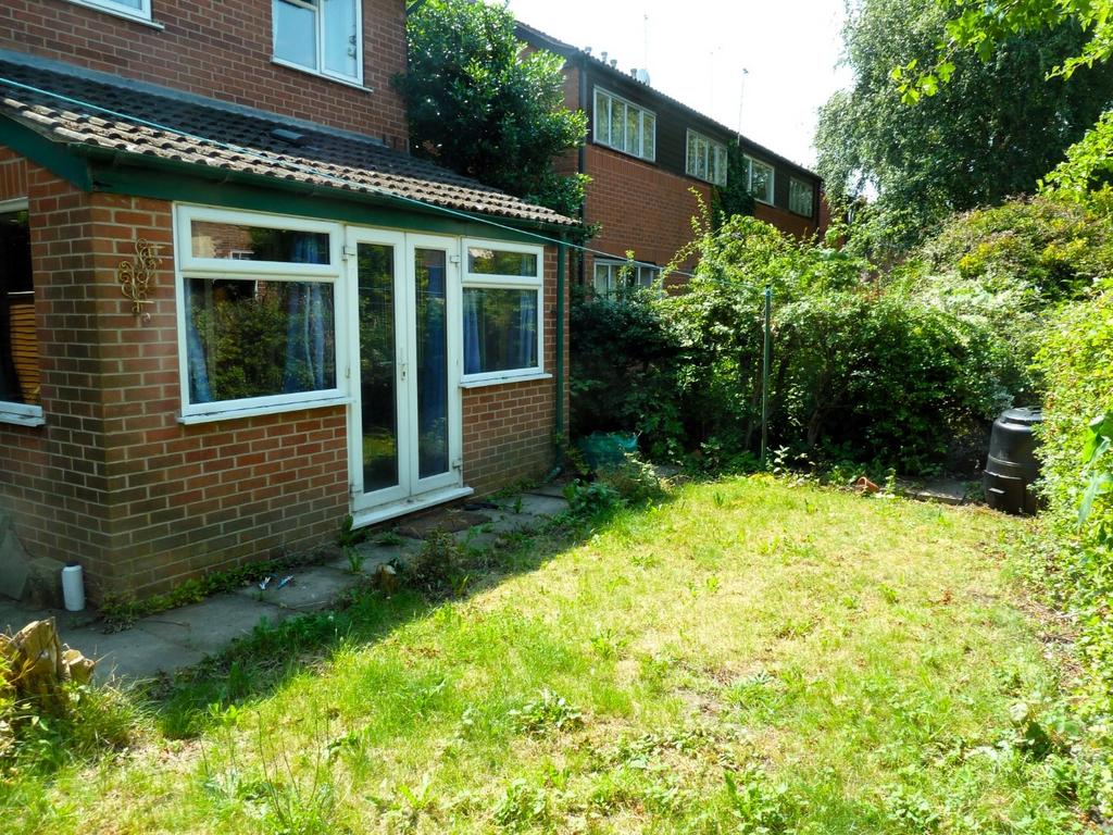 Sunny private rear garden with lawn, mature hed...
