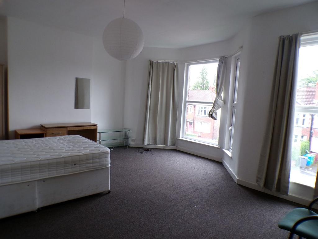Spacious front-facing bedroom with large bay wi...