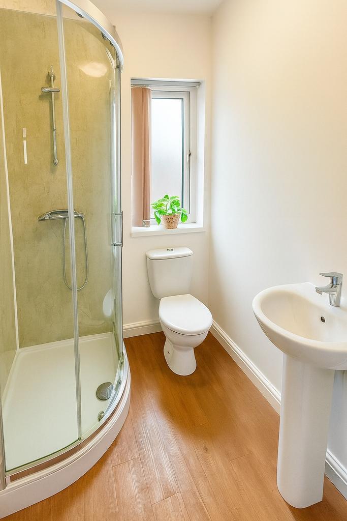 Bright and clean bathroom featuring a modern cu...