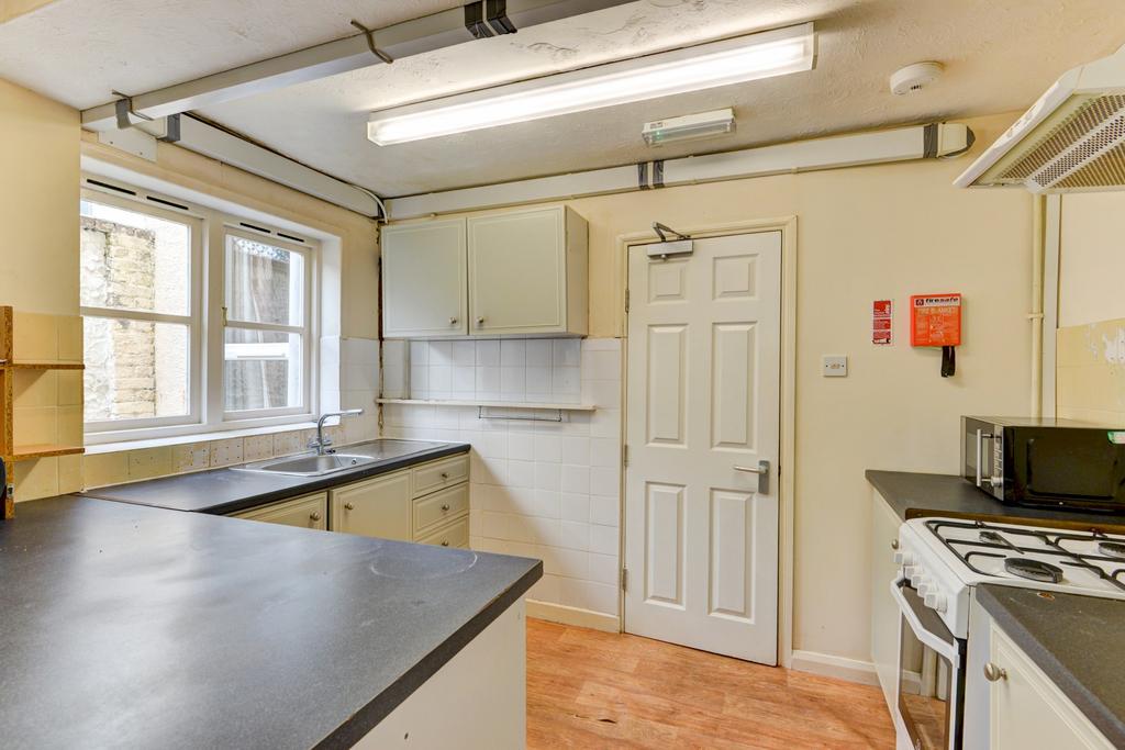 Bright and well-maintained kitchen with ample c...