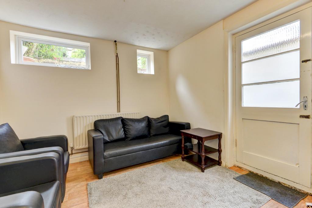 Bright, simply furnished living room with comfo...