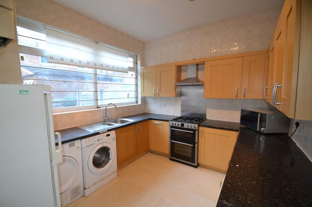 Bright and functional kitchen with ample natura...