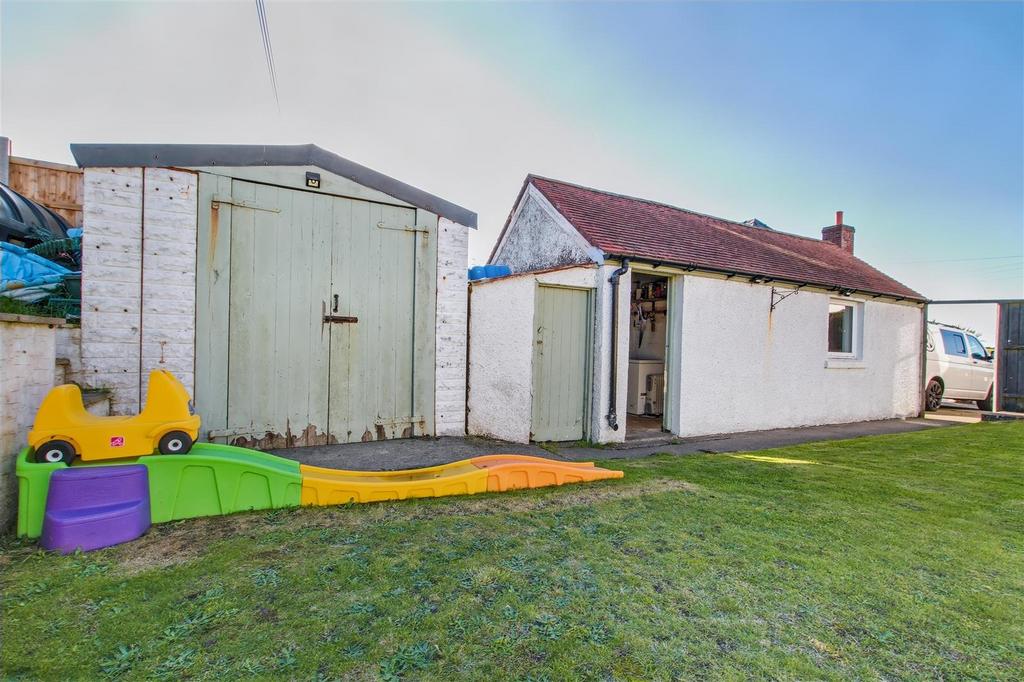 Detached garage and store sheds