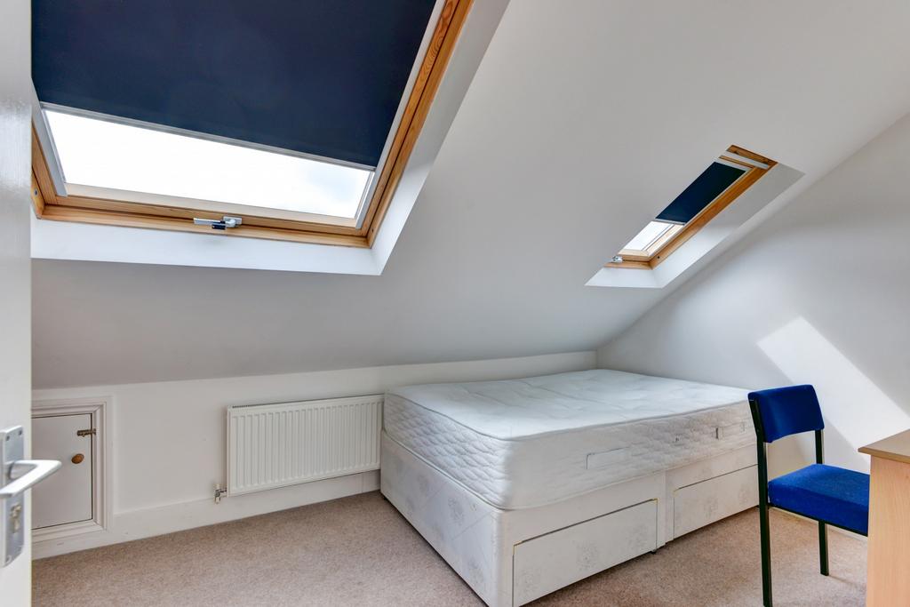 Bright, neatly presented attic bedroom with a c...
