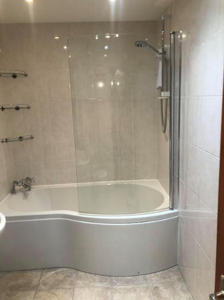 A modern and clean bathroom featuring a stylish...
