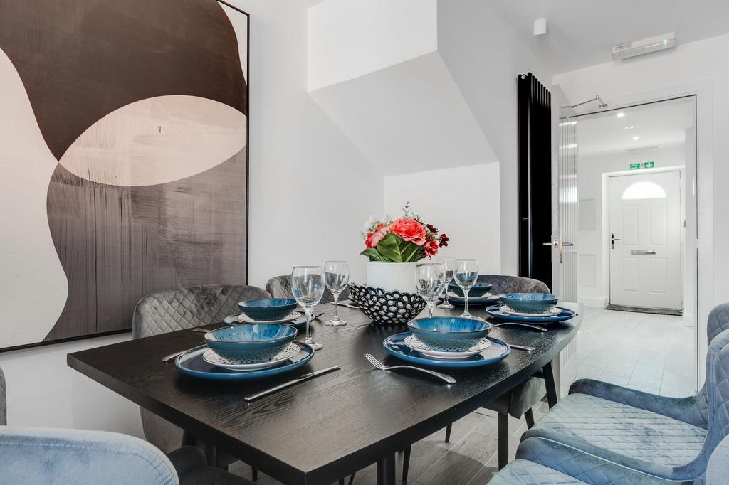 A modern, well-lit living room featuring contem...